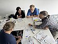 Empleados de Projektron en el seminario SAFe® en Peniche, Portugal, con el formador André Türpe; éxito del examen y tiempo libre en la playa.