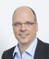 Oliver Regelmann, Prokurist und Teamleiter Infrastruktur & Collaboration bei der n-komm GmbH, begleitete die Einführung und Weiterentwicklung von BCS. Porträt von Oliver Regelmann, Prokurist und Teamleiter Infrastruktur & Collaboration bei der n-komm GmbH